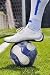 Human Leg and Soccer Ball on the Grass Field - 24