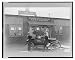 Historic Print (L): [Three men at automobile in front of American Library Association...