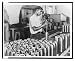 Historic Print (L): India in the war. A worker in one of India's fast expanding munitions plants. India prod