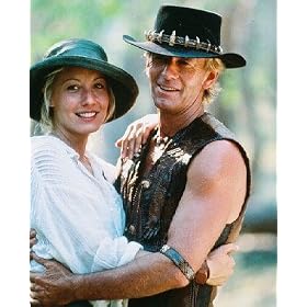 LINDA KOZLOWSKI AS SUE CHARLTON, PAUL HOGAN AS MICHAEL J. 'CROCODILE' DUNDEE FROM CROCODILE DUNDEE #1 - COLOUR Movie Photo - (4 Different Photograph & POSTER Sizes Available)