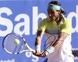 Raphael Nadal Autographed/Hand Signed Hitting the Ball 8x10 Photo (Online Authentics)