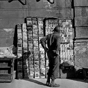 American GI Perusing Book Vendors’ Stand during WWII Photographic Poster Print by Robert Capa, 24×24