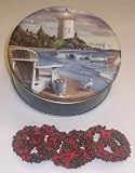 Scott's Cakes 1 lb. Dark Chocolate Covered Pretzel with Christmas Jimmies & Chocolate Chips in a Lighthouse Tin