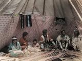 American Indian Family Relaxes Inside their Tipi Photographic Poster Print by Edwin L. Wisherd, 24x18