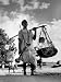 Muslim Man carrying his son and hookah in Convoy to West Punjab to Escape Anti Muslim Sikhs Photogra