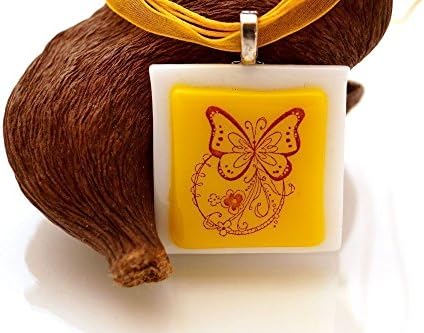 Yellow and white glass necklace with butterfly on a ribbon chokker.
