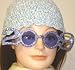 Hand Crocheted Blue Chenille and Gimp Skull Cap Offered in Combination with Purple Frame 2009 Welcoming Sunglasses Image