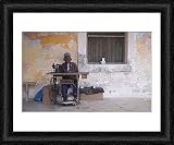 Framed Print of A man works his sewing machine on Ibo Island from AWL Discover Images.com