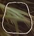 16 inch string of freshwater pearls 3.5-4mm flattened with silver clasp