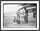 Newswire Photo (XL): Pre-game activities at home plate involving managers, umpires, and grounds crew