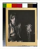 Historic Print (S): [Kahlil Gibran in Middle Eastern(?) costume with leopard skin and staff, seated]