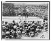Historic Print (L): [Two boxers and referee in outdoor boxing ring, surrounded by audience]