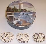 Scott's Cakes Milk Chocolate Covered Pretzel with White Chocolate Chips in a Mini Lighthouse Tin
