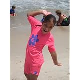 UV Protective Rash Guard Swim Shirt in Youth sizes. Purple and Pink with contrasting flower. Maximum UV Protection rated UPF 50+. Chlorine Resistant fabric. Shorts sold separately.