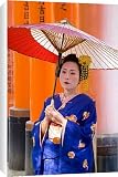 Canvas Prints of Portrait of a geisha holding an ornate red umbrella from Robert Harding