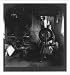 Historic Print (L): Wool spinning in an Irish cottage (man weaving tweeds), Carrick, County Doneagal