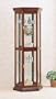 "All new item Cherry finish wood curio cabinet with glass shelves, mirrored back and glass doors"