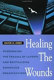Healing the Wounds: Overcoming the Trauma of Layoffs and Revitalizing Downsized Organizations (Jossey-Bass Management Series)