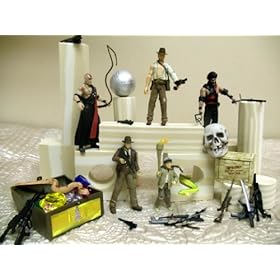  Exclusive Indiana Jones 59 Piece Play Set Featuring 5 Posable Indiana Jones Figures With All The Accessories, 1 Treasure Chest Filled With 12 Jewels, 1 Medium Skull, 1 Boulder, 2 Snakes, 10 Building Blocks And A 25 Piece Cache Of Weapons