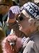 Female Holding Pink Poodle Wearing Hat Emblazoned with Reagan During Campaign Speech Photographic Poster Print by Bill Ray, 30x40
