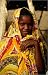 photographie Young woman in colourful wrap. est disperible en (L x H): 50 x 80 cm de C. Pershouse