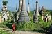 Young Monk Walkng between Stupas - 24