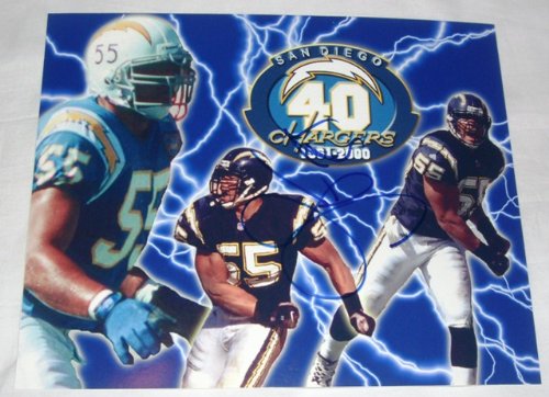 Junior Seau Autographed San Diego Chargers 8x10 Photo W/PROOF, Picture of Junior Signing For, San Diego Chargers, New England Patriots, Miami Dolphins, USC Trojans