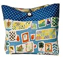 ArtisanStreet's Blue Tote with Polka Dots. Features Medium Blue Background with Images of Leaves, Trees & Flowers in Shades of Blue, Orange & Green. With Vintage Buttons. Hand Crafted, One of a Kind