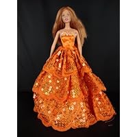 A Bright Orange Ball Gown with Orange Sequins Made to Fit the Barbie Doll