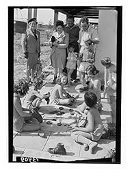 Home: 1946 Photo Children of the settlement of Gat busy polishing their shoes Location: Gat, Israel - Historic Photos