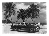 Historic Print (S): 1951 Buick LeSabre convertible on bathing beach; model is posed in front seat