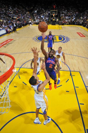 New York Knicks v Golden State Warriors: Raymond Felton and Stephen Curry Photographic Poster Print by Rocky Widner, 24x36