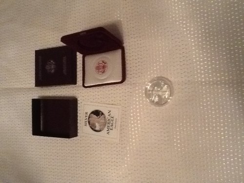 1991 Proof American Eagle Silver Dollar with Original Packaging & Certificate of Authenticity.