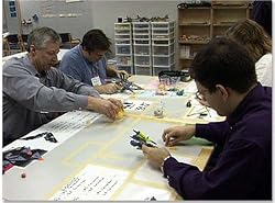 Learning Lean Through Simulation