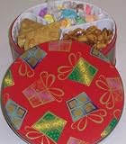 Scott's Cakes Taffy, Peanut Brittle, and Sassy Peanut Combo in a Christmas Present Tin