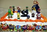 Mario Brothers Birthday Party 28 Piece Mario Birthday Cake Topper Featuring Mario, Luigi, Bullet, Toad, Mushroom, Goomba, Koopa, Shy, Bomb, Lakitu Spiny, Mario Coins, Large Bomb, and 12 Mario 1 Decorative Buttons