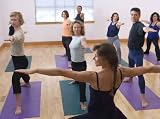 Teacher Guides Student in Yoga Class - 60
