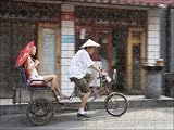 Photo Jigsaw 17x12 (43x30cm) Asian woman (Chinese-Thai) riding in cycle rickshaw from Robert Harding