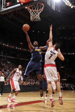 Denver Nuggets v Toronto Raptors: Andrea Bargnani and Nene Photographic Poster Print by Ron Turenne, 28x42