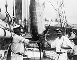 1930s photo Ernest Hemingway posed with Capt. Joe Russell of Key West beside hanging marlin or sailf