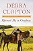 Kissed by a Cowboy (A Four of Hearts Ranch Romance)