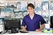 Portrait of a Sales Assistant behind the Counter - 72W x 48H - Peel and Stick Wall Decal by Wallmonkeys