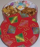 Scott's Cakes Taffy, Pretzel Brittle, and Sassy Peanut Combo in a Christmas Present Tin