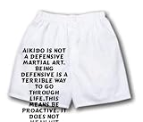 White Boxer Short with Aikido is not a defensive martial art. Being defensive is a terrible way to go through life.This means be proactive. It does not mean hit first. - Dojo wall