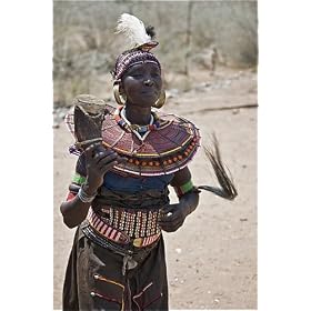 Photographic Prints of An old Pokot woman dancing during an Atelo ceremony. The cow horn container from AWL Discover Images
