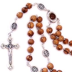 Olive wood beads Rosary made with Silver our Father beads and Soil Rosary Center from the Holy Land. Comes with gift Bag and Certificate