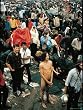 Naked Man Standing in Mud Amid Rain Drenched Crowd at Woodstock Music and Art Festival Photographic Poster Print by Bill Eppridge, 18x24