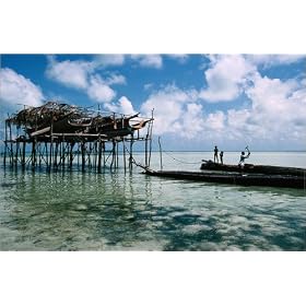 photographie Men and boys of Sea gypsy community working on wooden boats, north of Semporna. est ...