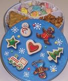 Scott's Cakes Taffy, Peanut Brittle, and Sassy Peanut Combo in a Christmas Cookie Tin