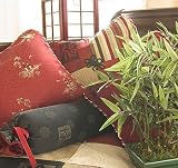 Sticky Rice Black Roll Pillow by Glenna Jean